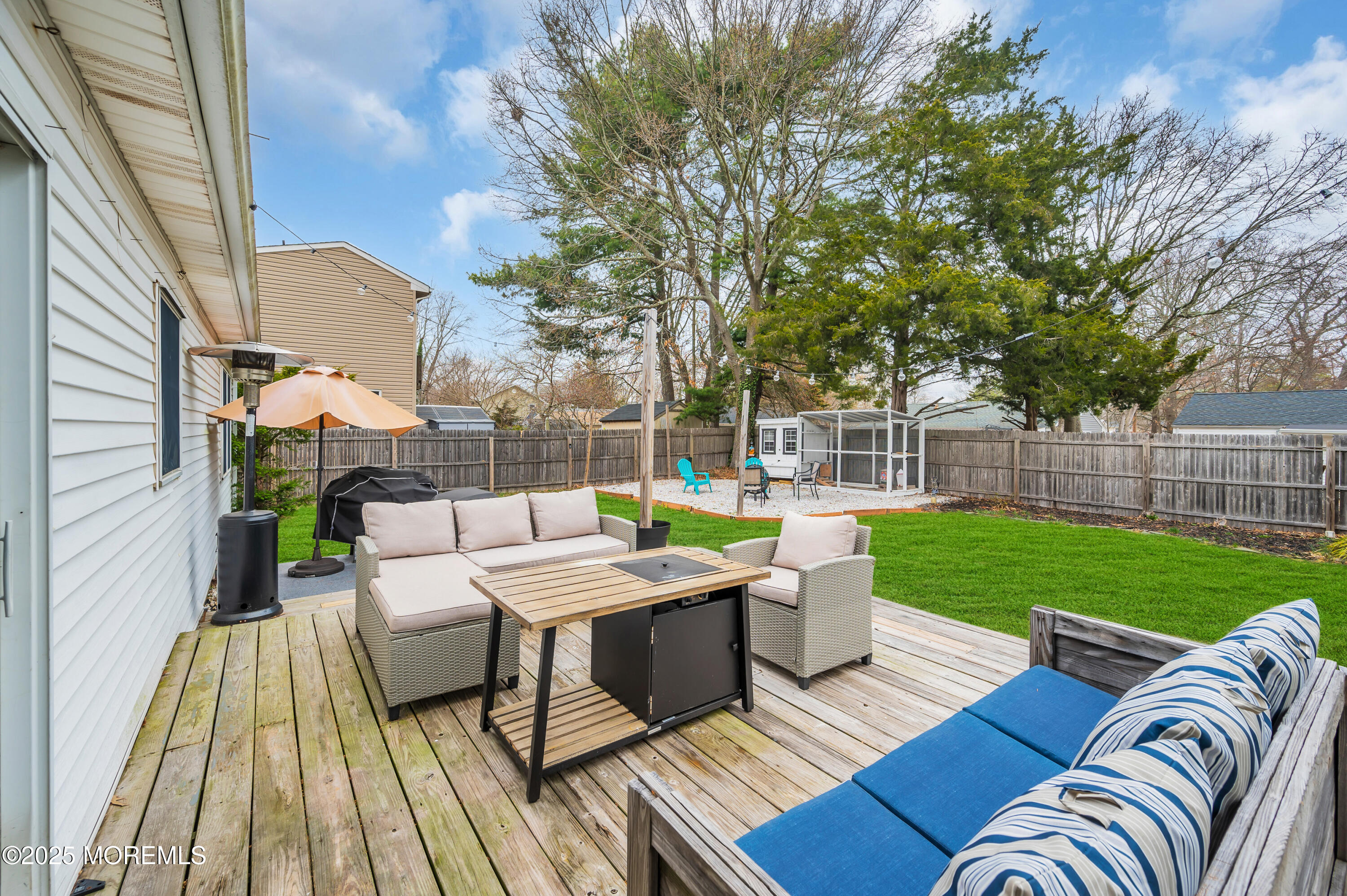 408 Cedar Drive Lanoka Harbor, NJ 08734 - Photo 32 of 39 a view of a patio with couches chairs and a table and chairs