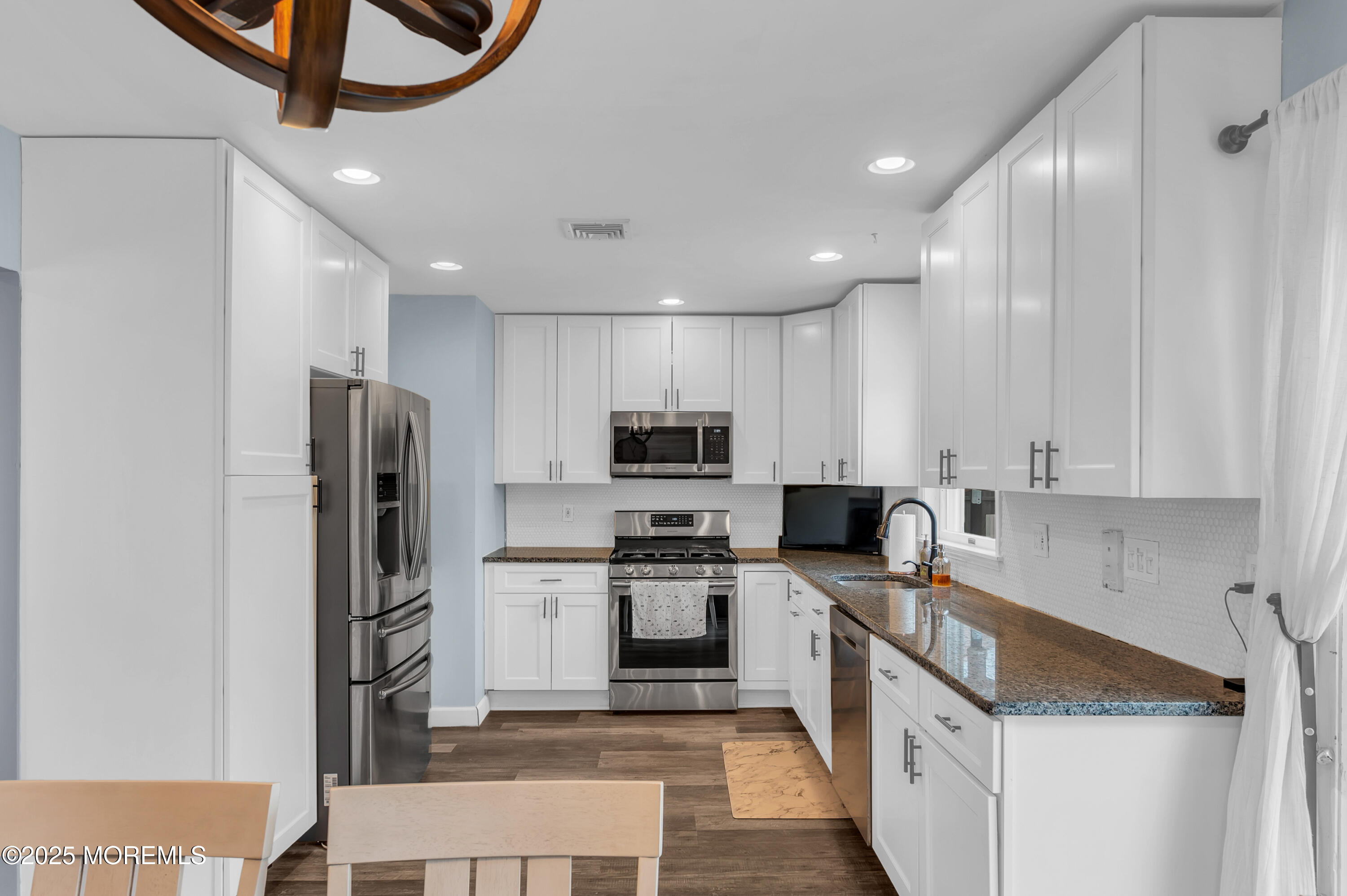 408 Cedar Drive Lanoka Harbor, NJ 08734 - Photo 4 of 39 a kitchen with stainless steel appliances granite countertop a refrigerator stove microwave and sink