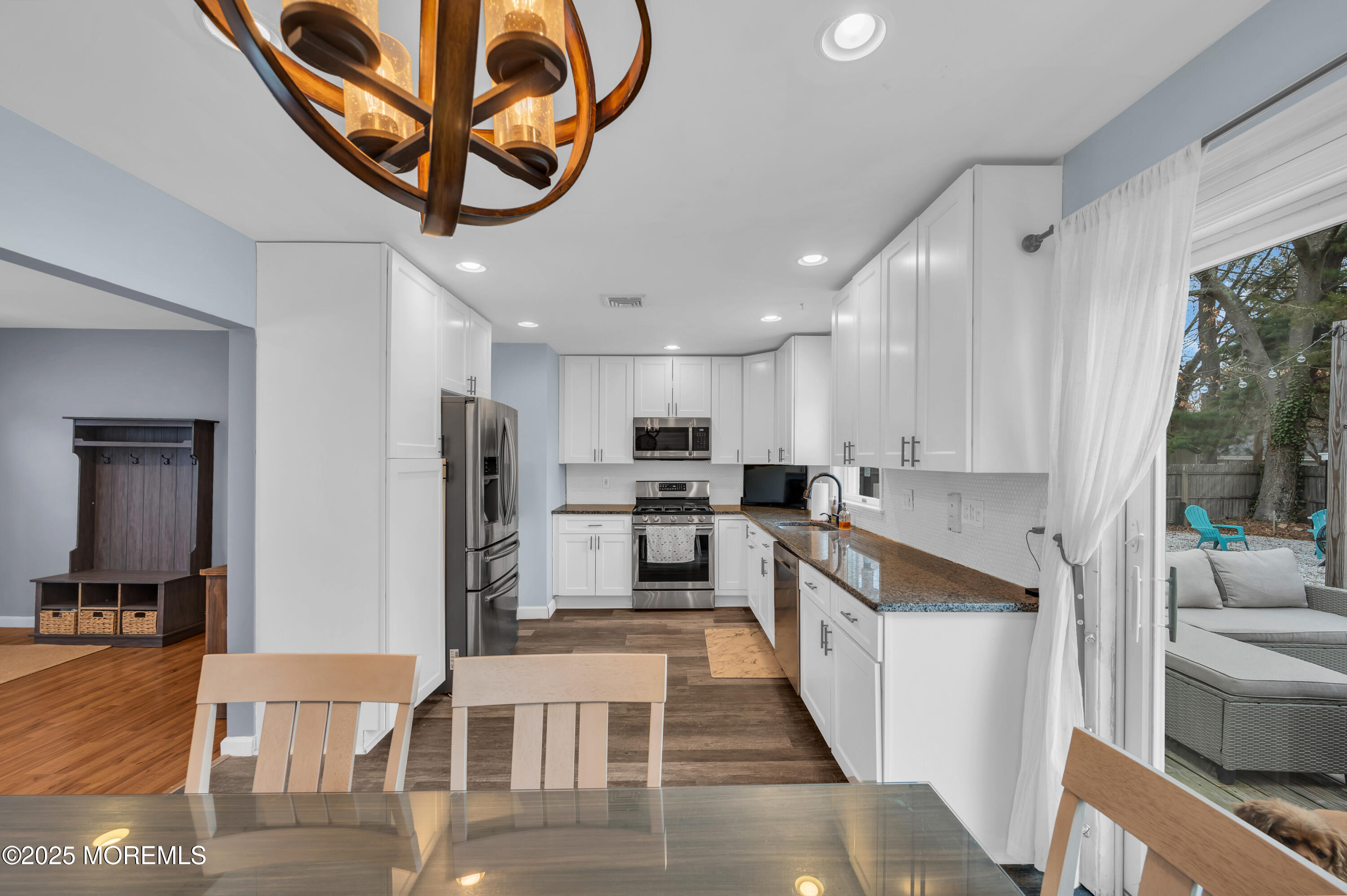 408 Cedar Drive Lanoka Harbor, NJ 08734 - Photo 8 of 39 a kitchen with stainless steel appliances kitchen island granite countertop a refrigerator and microwave