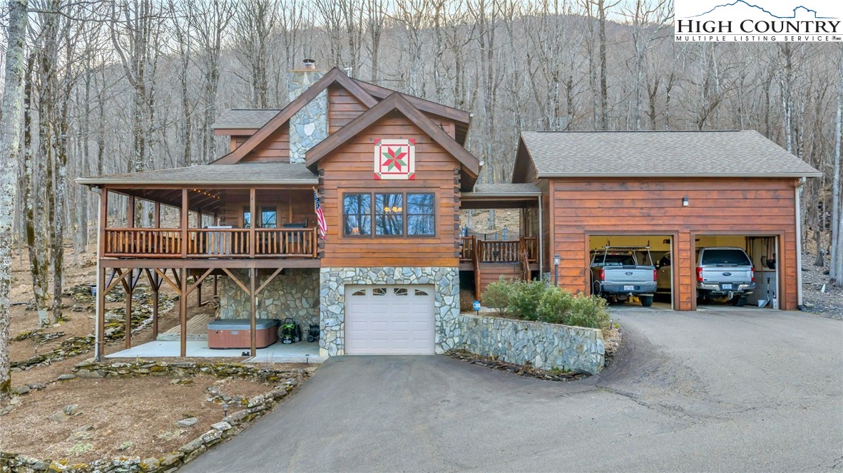 632 Big Tree Road West Jefferson, NC 28694 - Photo 1 of 48 a front view of a house with garden
