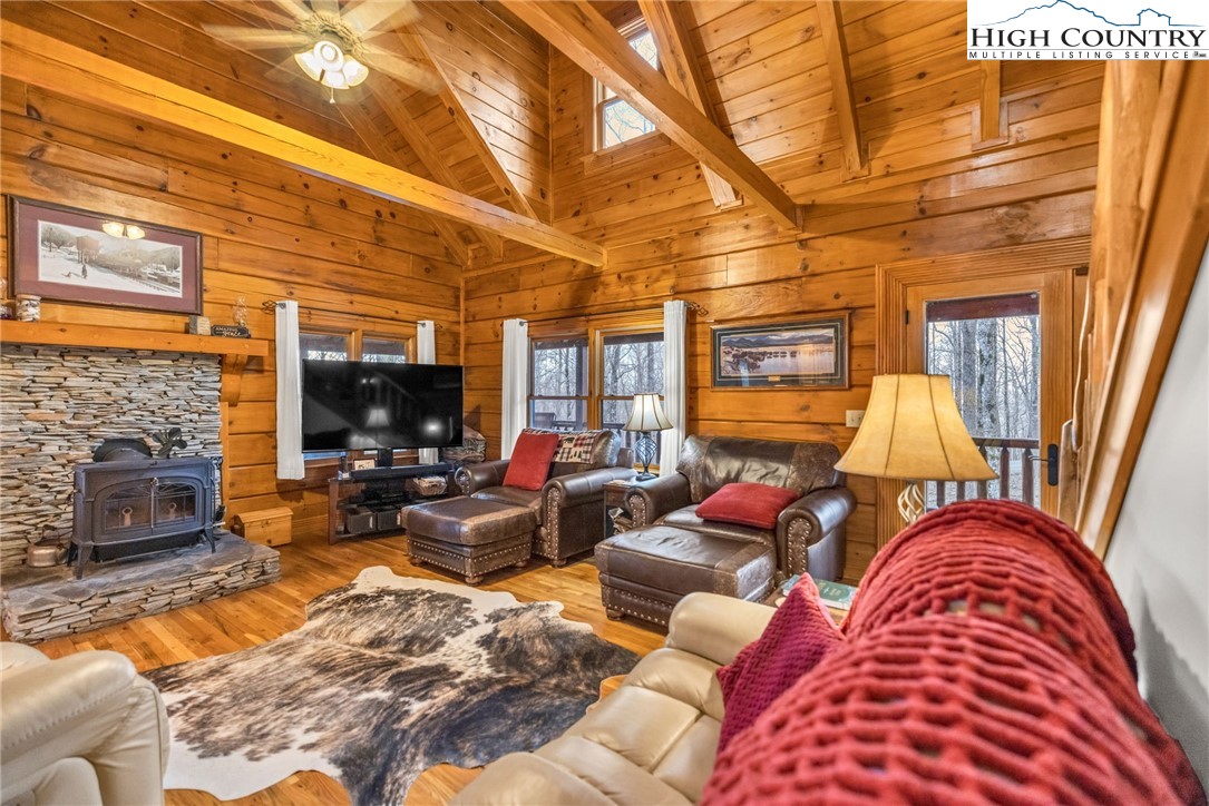 632 Big Tree Road West Jefferson, NC 28694 - Photo 14 of 48 a living room with furniture fireplace and a flat screen tv