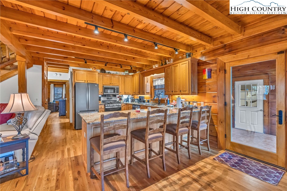 632 Big Tree Road West Jefferson, NC 28694 - Photo 16 of 48 a view of a dining room with furniture and a rug