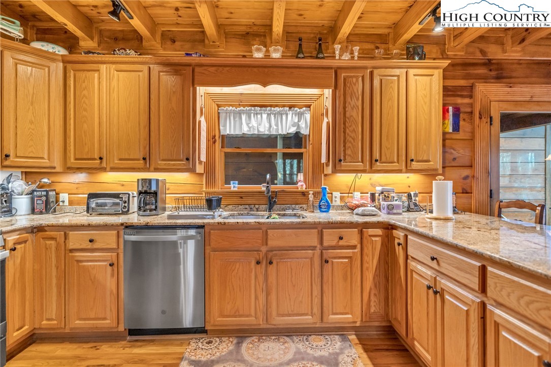 632 Big Tree Road West Jefferson, NC 28694 - Photo 19 of 48 a kitchen with stainless steel appliances granite countertop a sink and a stove