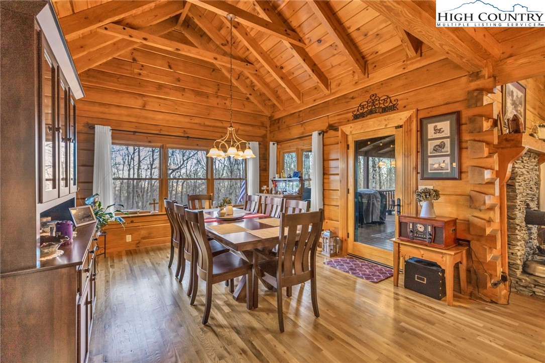 632 Big Tree Road West Jefferson, NC 28694 - Photo 23 of 48 a dining room with furniture wooden floor and a rug