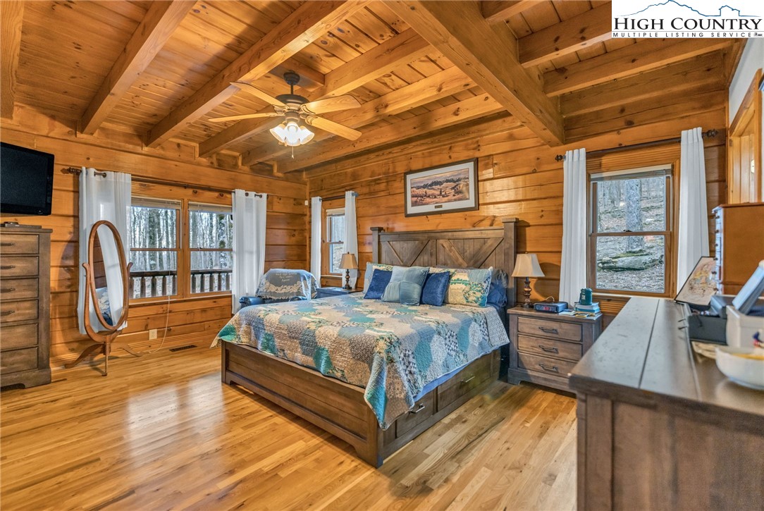 632 Big Tree Road West Jefferson, NC 28694 - Photo 24 of 48 a bed sitting in a spacious bedroom next to a window