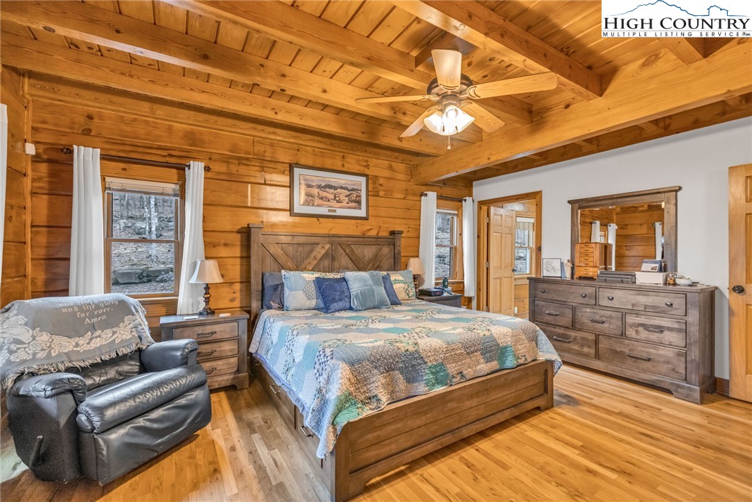 632 Big Tree Road West Jefferson, NC 28694 - Photo 25 of 48 a bedroom with a bed couch and window