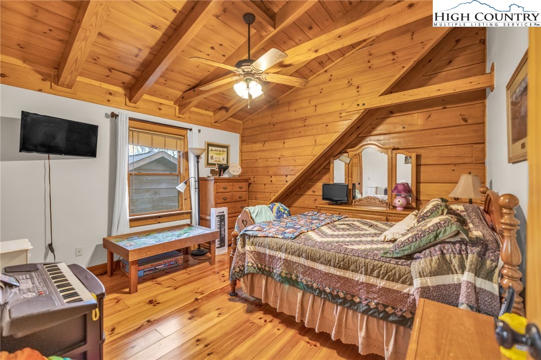 632 Big Tree Road West Jefferson, NC 28694 - Photo 31 of 48 a bedroom with furniture and a flat screen tv