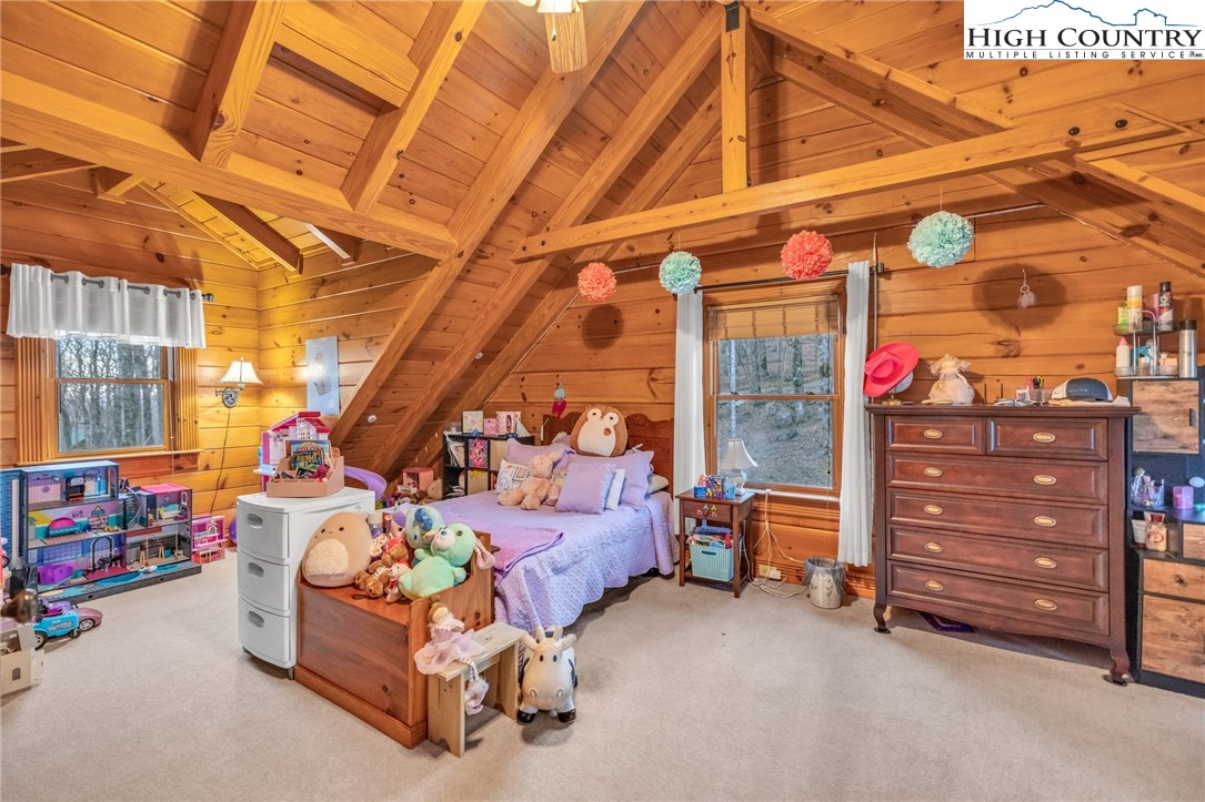 632 Big Tree Road West Jefferson, NC 28694 - Photo 34 of 48 a bedroom with furniture and a baby crib