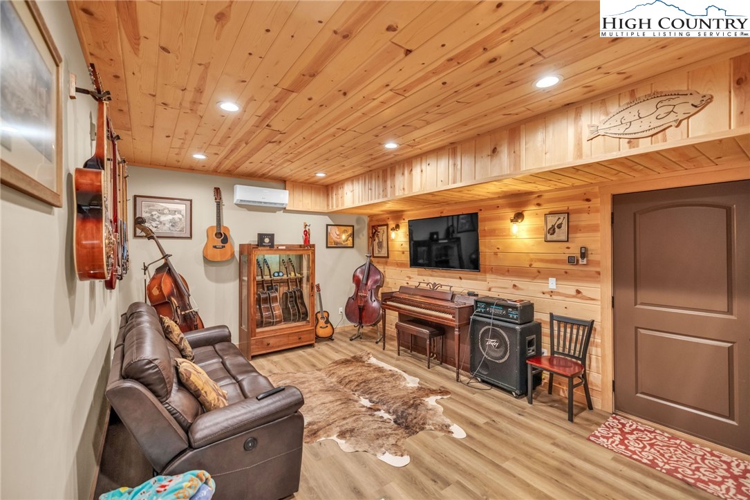 632 Big Tree Road West Jefferson, NC 28694 - Photo 36 of 48 a view of a living room with furniture and a flat screen tv