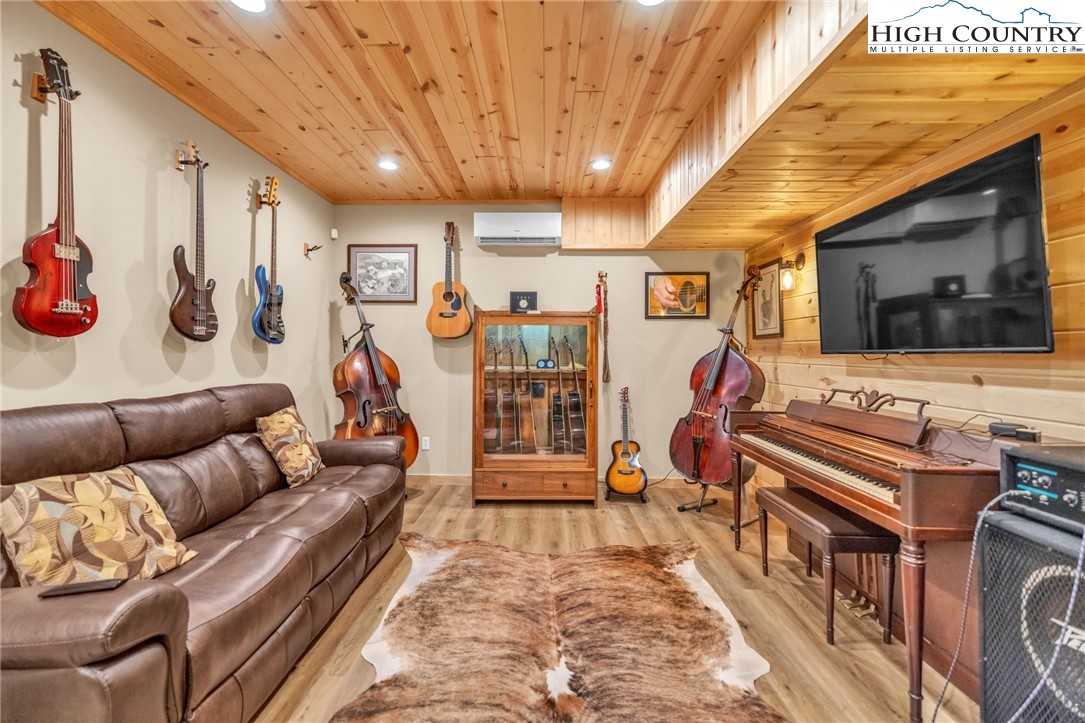 632 Big Tree Road West Jefferson, NC 28694 - Photo 37 of 48 a living room with furniture and a flat screen tv