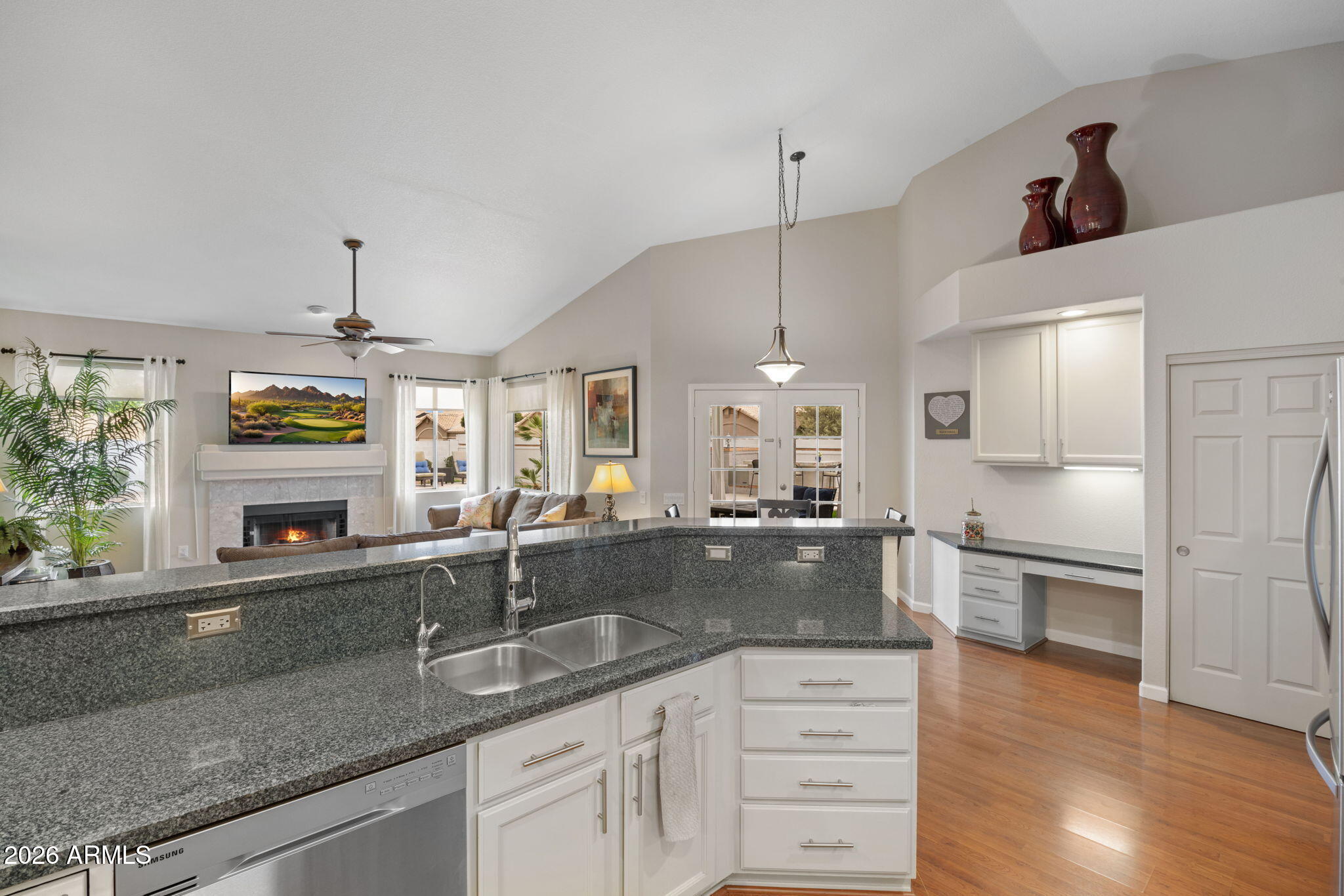 16008 South 38th Way Phoenix, AZ 85048 - Photo 11 of 47 a large kitchen with granite countertop a sink a counter space appliances and cabinets