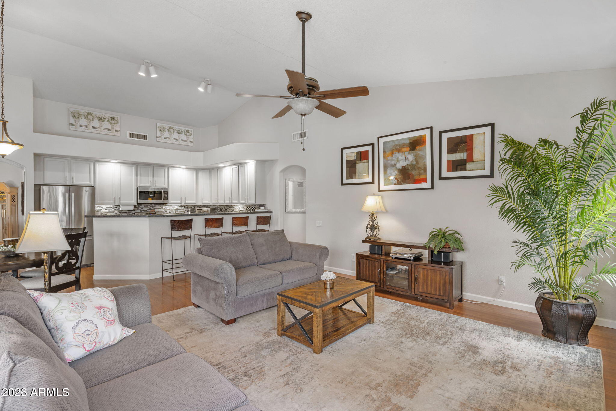 16008 South 38th Way Phoenix, AZ 85048 - Photo 17 of 47 a living room with furniture kitchen view and a potted plant