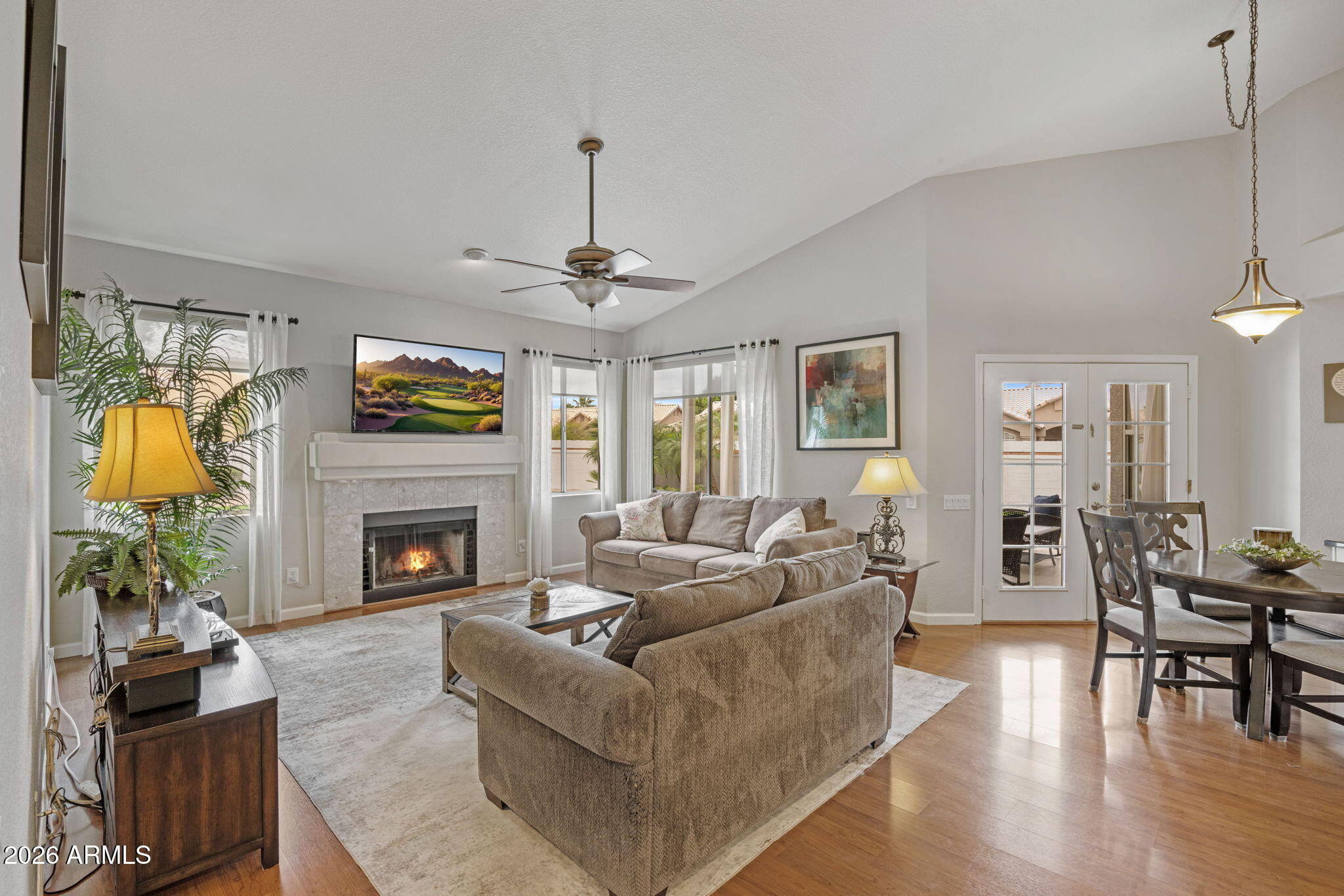 16008 South 38th Way Phoenix, AZ 85048 - Photo 18 of 47 a living room with furniture and a fireplace