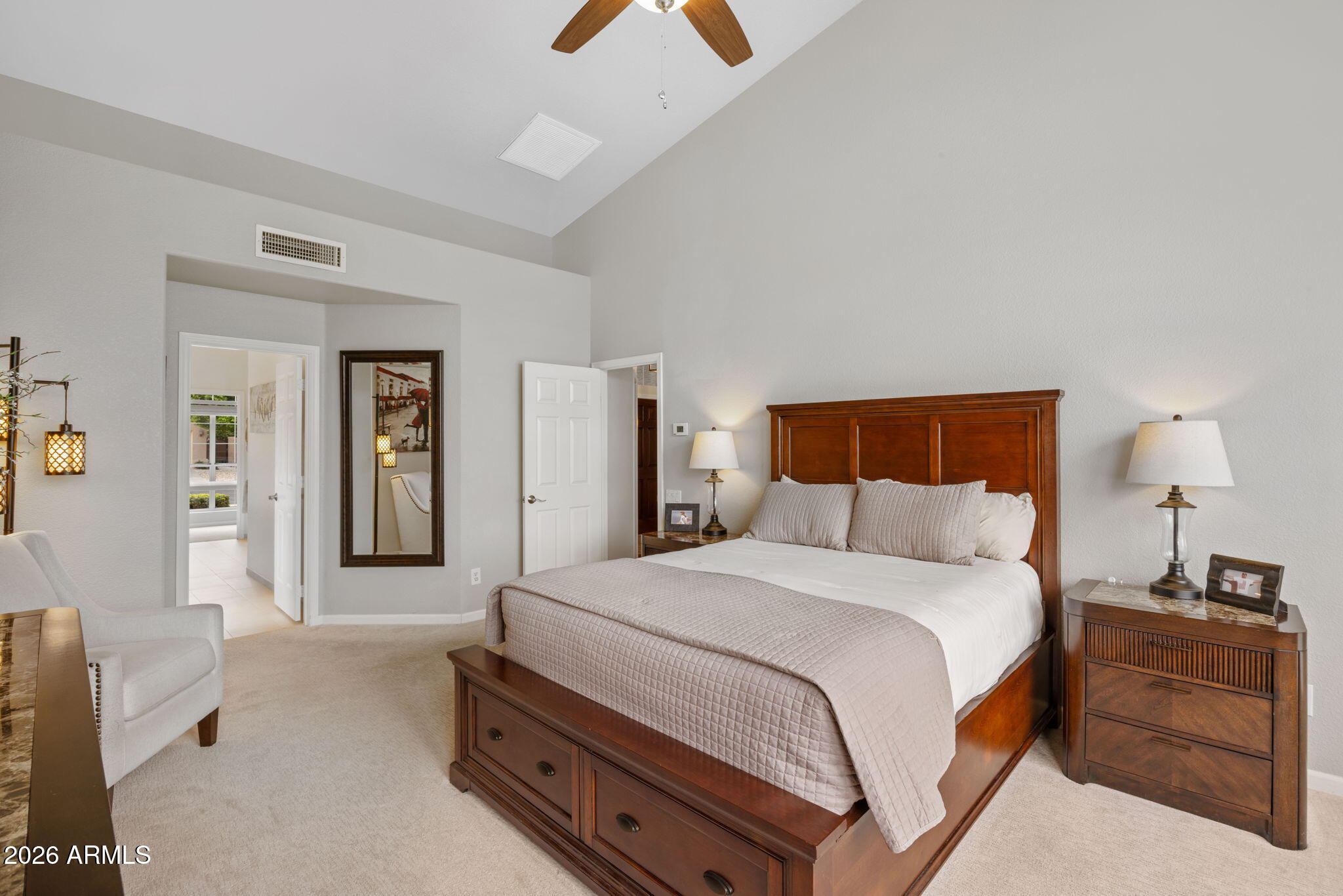 16008 South 38th Way Phoenix, AZ 85048 - Photo 23 of 47 a bedroom with a bed and a lamp