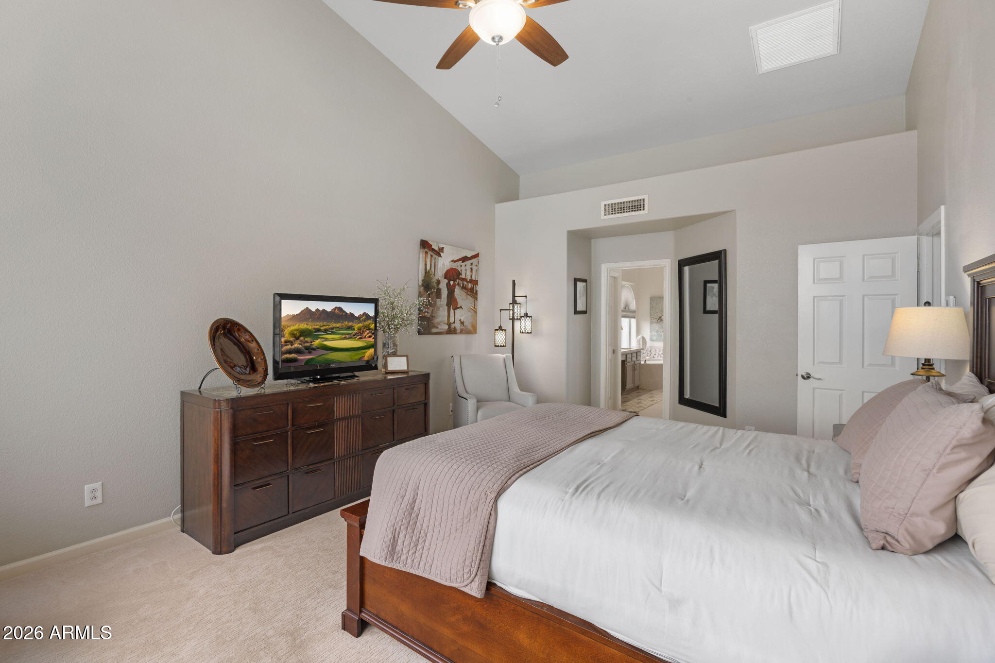 16008 South 38th Way Phoenix, AZ 85048 - Photo 24 of 47 a bedroom with a bed and a chandelier