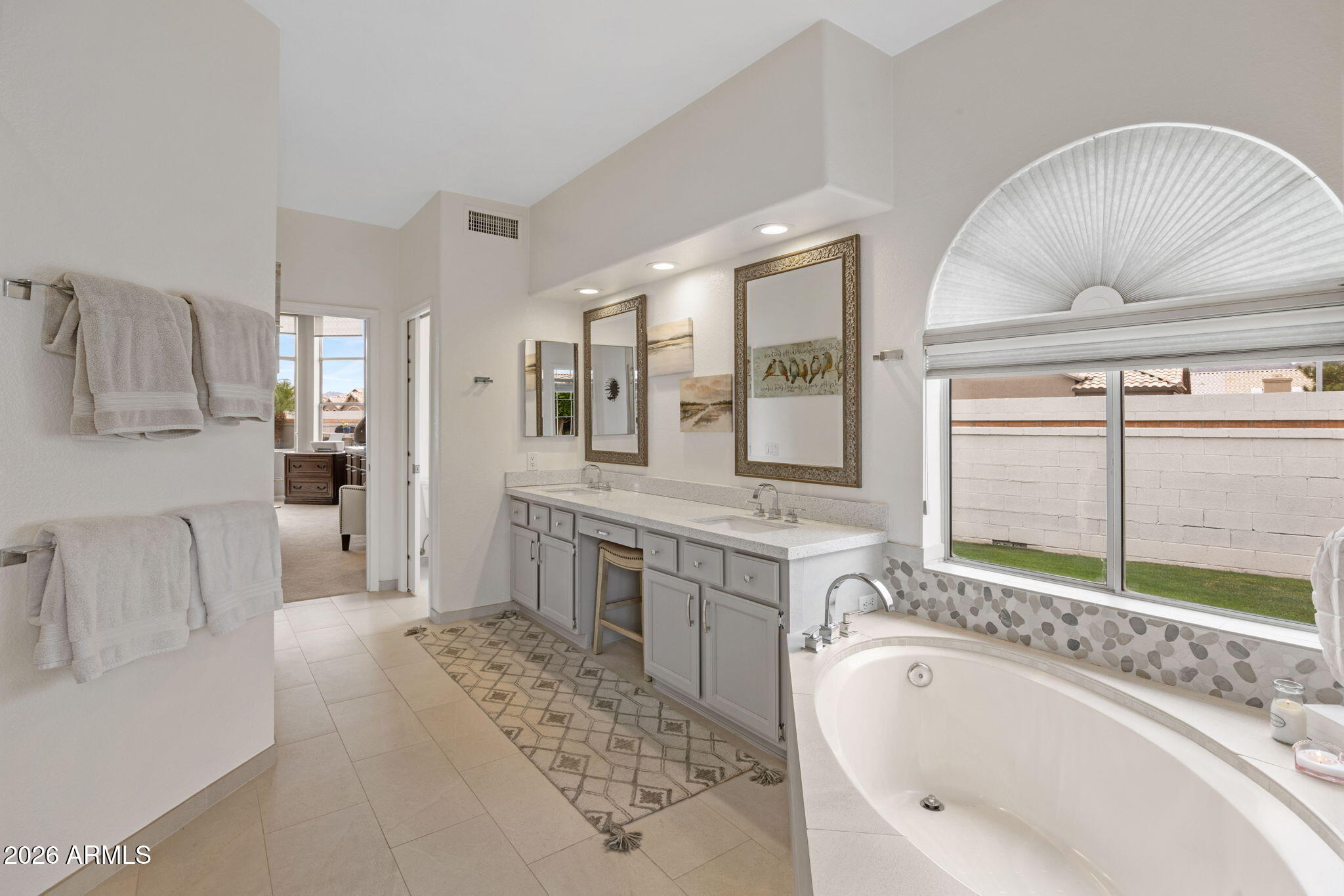 16008 South 38th Way Phoenix, AZ 85048 - Photo 27 of 47 a spacious bathroom with a tub sink and mirror