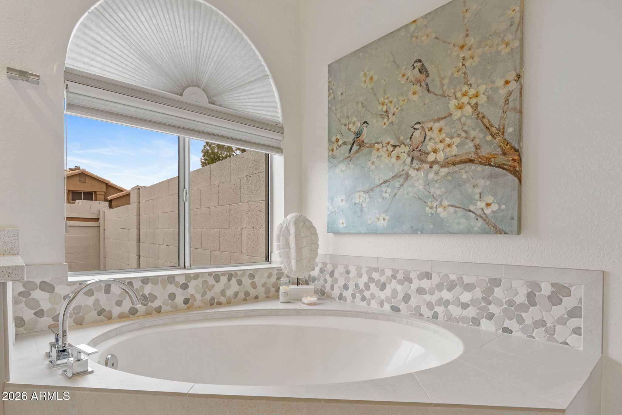 16008 South 38th Way Phoenix, AZ 85048 - Photo 28 of 47 a bathroom with a bathtub and a shower