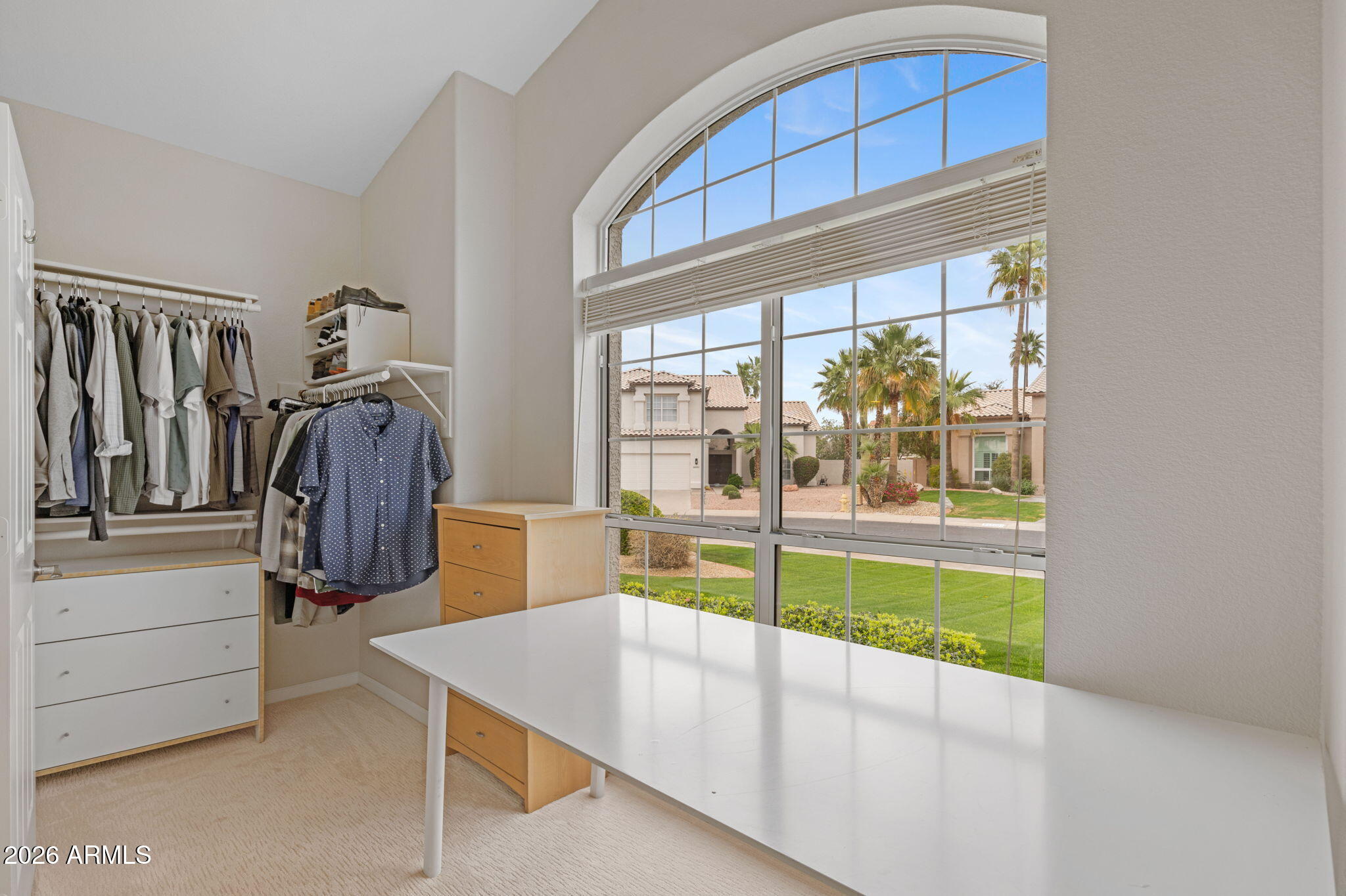 16008 South 38th Way Phoenix, AZ 85048 - Photo 29 of 47 a view of walk in closet with clothes and shoes