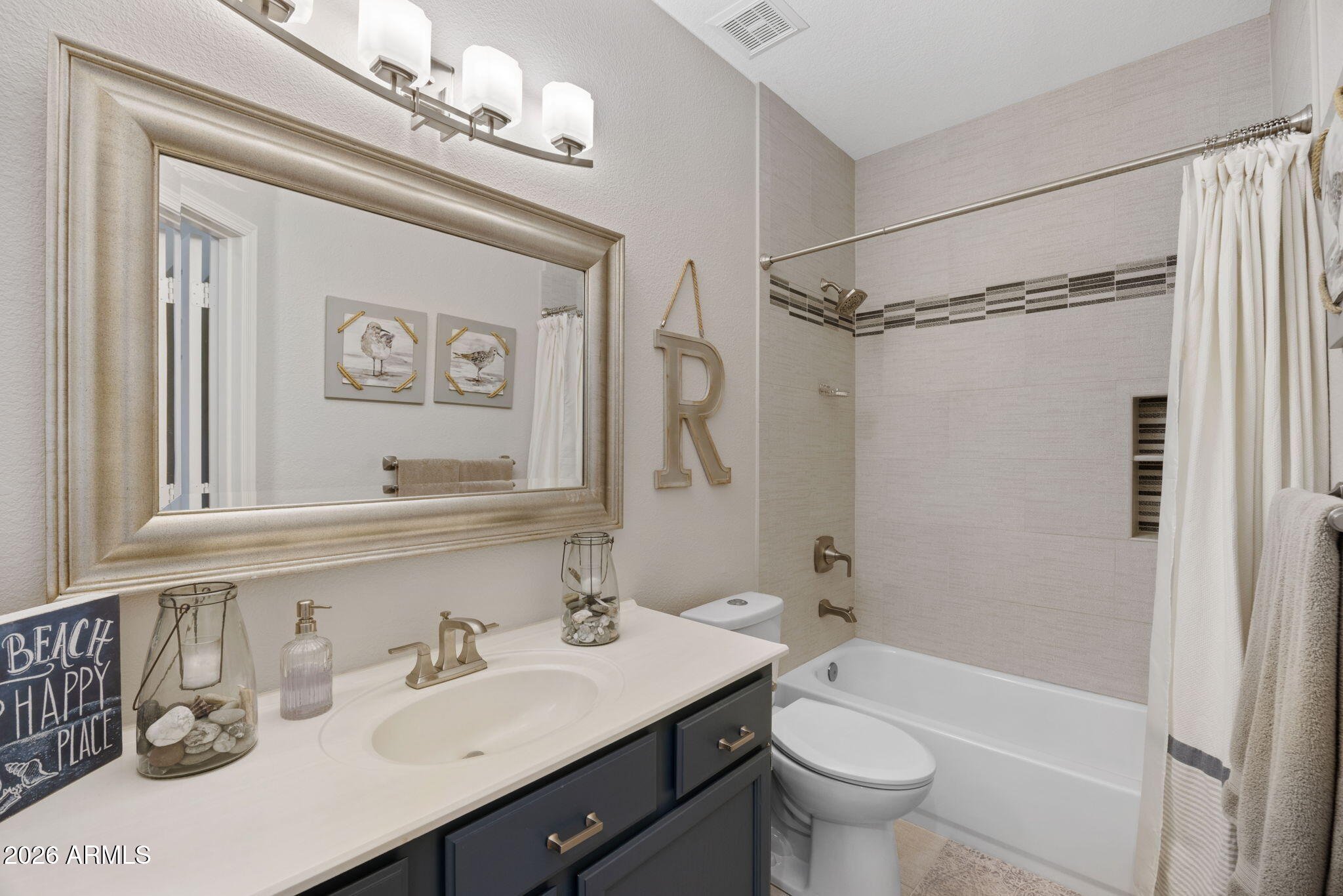 16008 South 38th Way Phoenix, AZ 85048 - Photo 31 of 47 a bathroom with a sink a toilet and a mirror