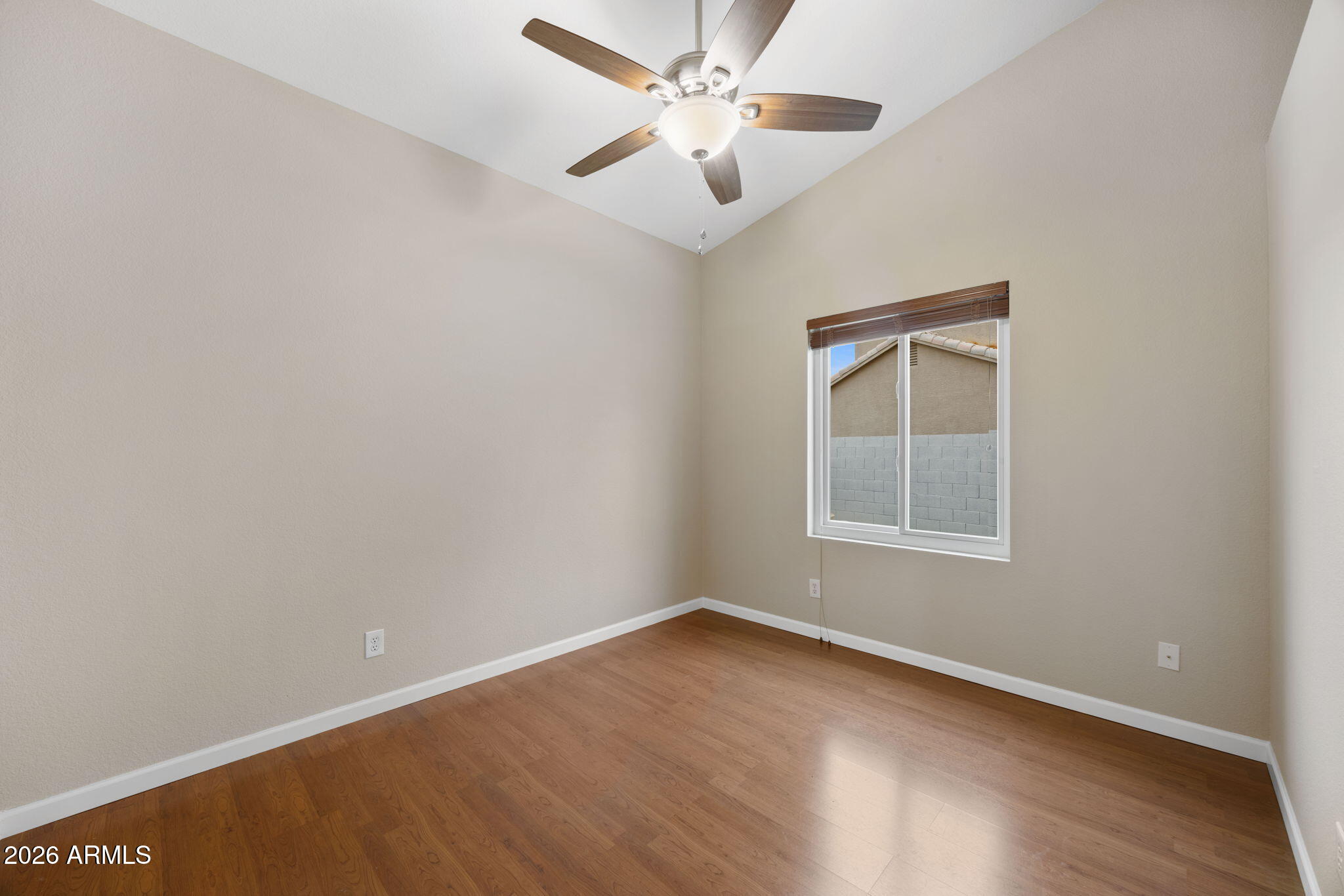 16008 South 38th Way Phoenix, AZ 85048 - Photo 32 of 47 an empty room with a window and a fan