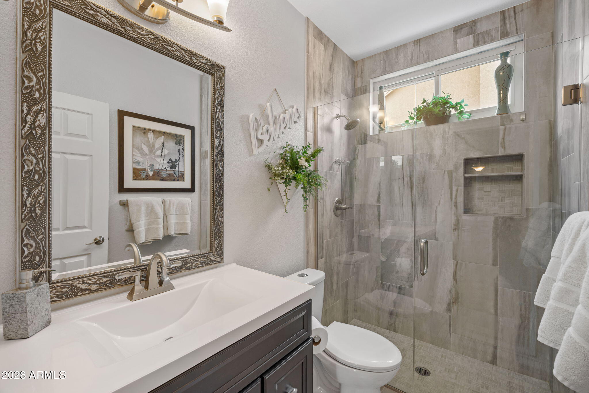 16008 South 38th Way Phoenix, AZ 85048 - Photo 33 of 47 a bathroom with a sink a toilet and shower