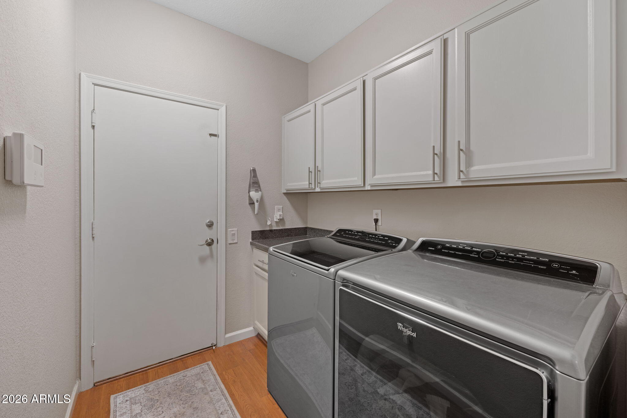 16008 South 38th Way Phoenix, AZ 85048 - Photo 34 of 47 a view of a storage and utility room with washer and dryer