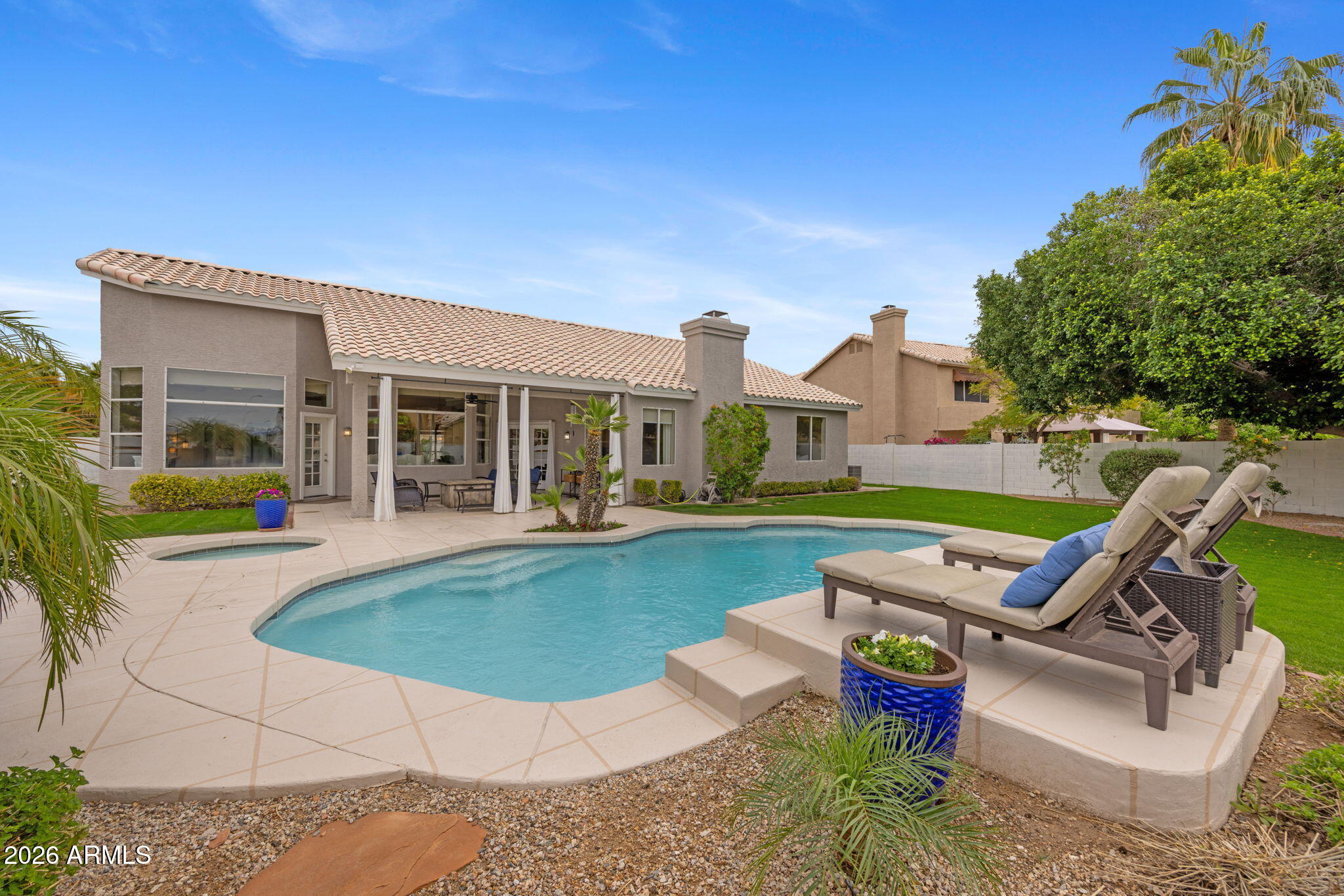 16008 South 38th Way Phoenix, AZ 85048 - Photo 39 of 47 a view of a house with swimming pool and sitting area
