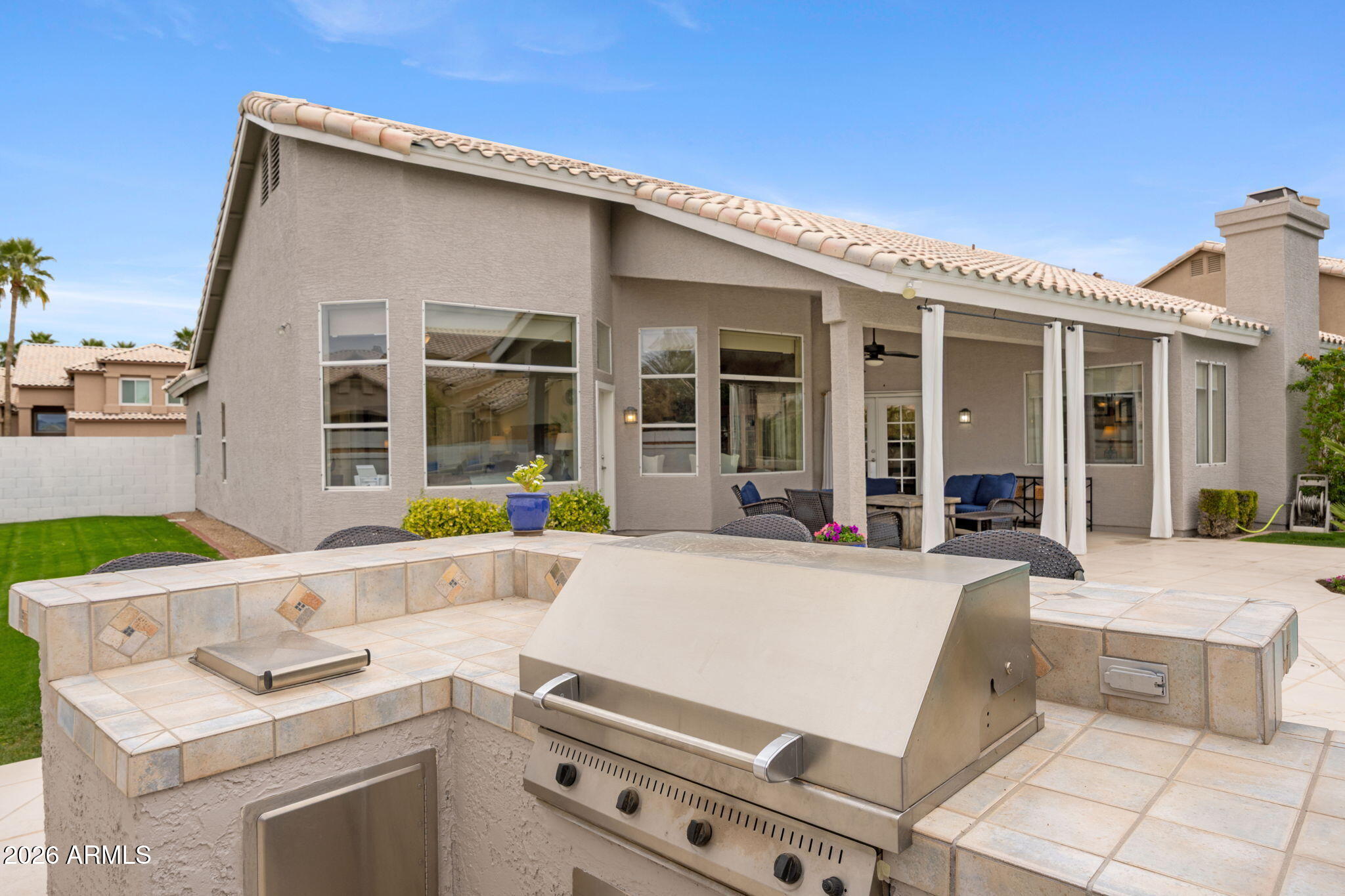 16008 South 38th Way Phoenix, AZ 85048 - Photo 42 of 47 a view of white house with outdoor seating