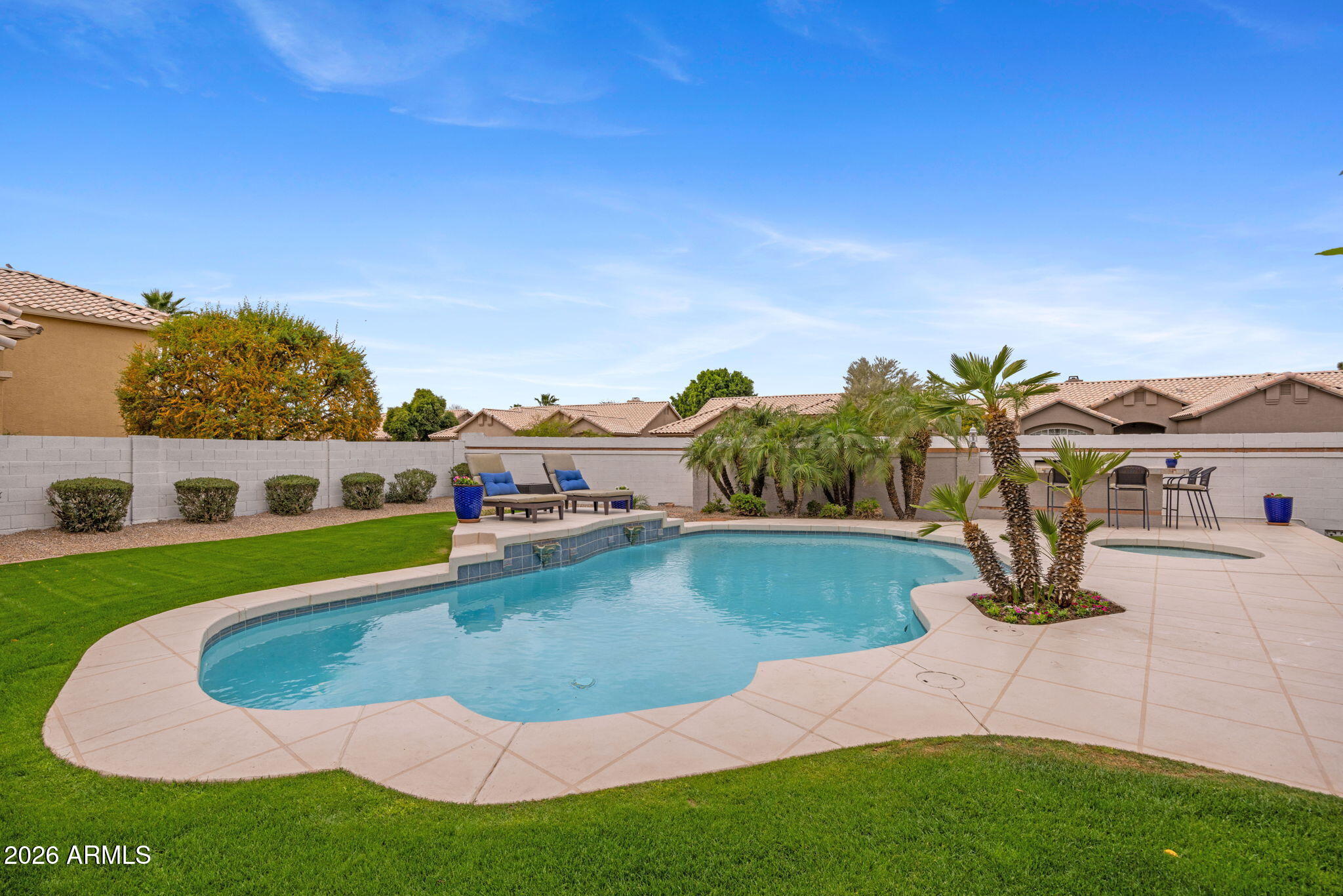 16008 South 38th Way Phoenix, AZ 85048 - Photo 44 of 47 a view of a swimming pool with a yard