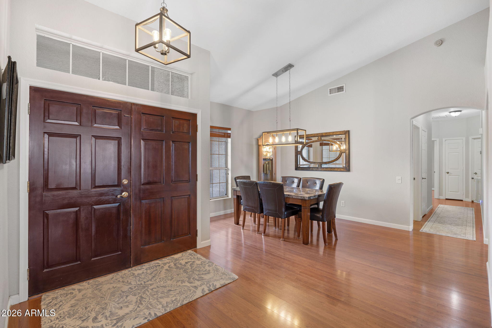 16008 South 38th Way Phoenix, AZ 85048 - Photo 6 of 47 a view of a dining room with furniture window and wooden floor