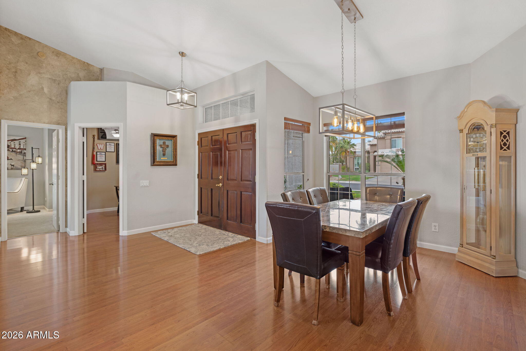 16008 South 38th Way Phoenix, AZ 85048 - Photo 7 of 47 a view of a dining room with furniture window and wooden floor