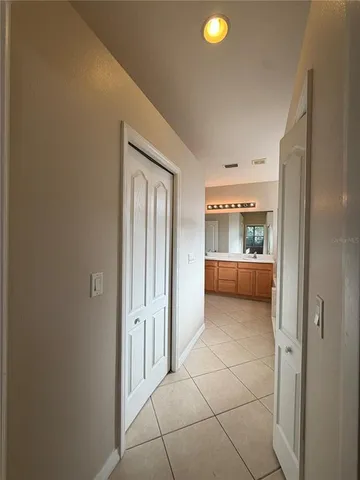 a white toilet sitting next to a white wall