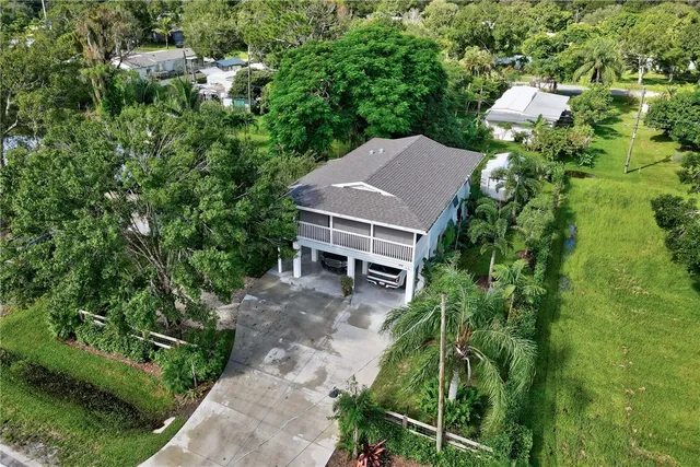 a view of house with a yard