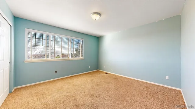 a view of utility room and bedroom