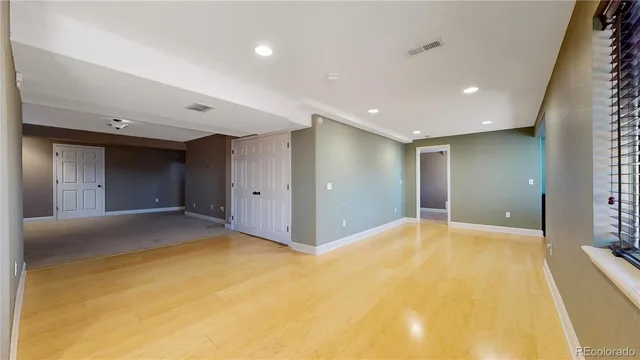 a view of an empty room with a window