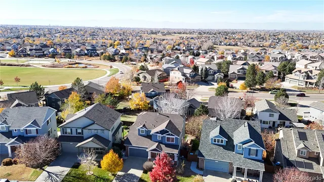 an aerial view of a house with a swimming pool outdoor seating and yard