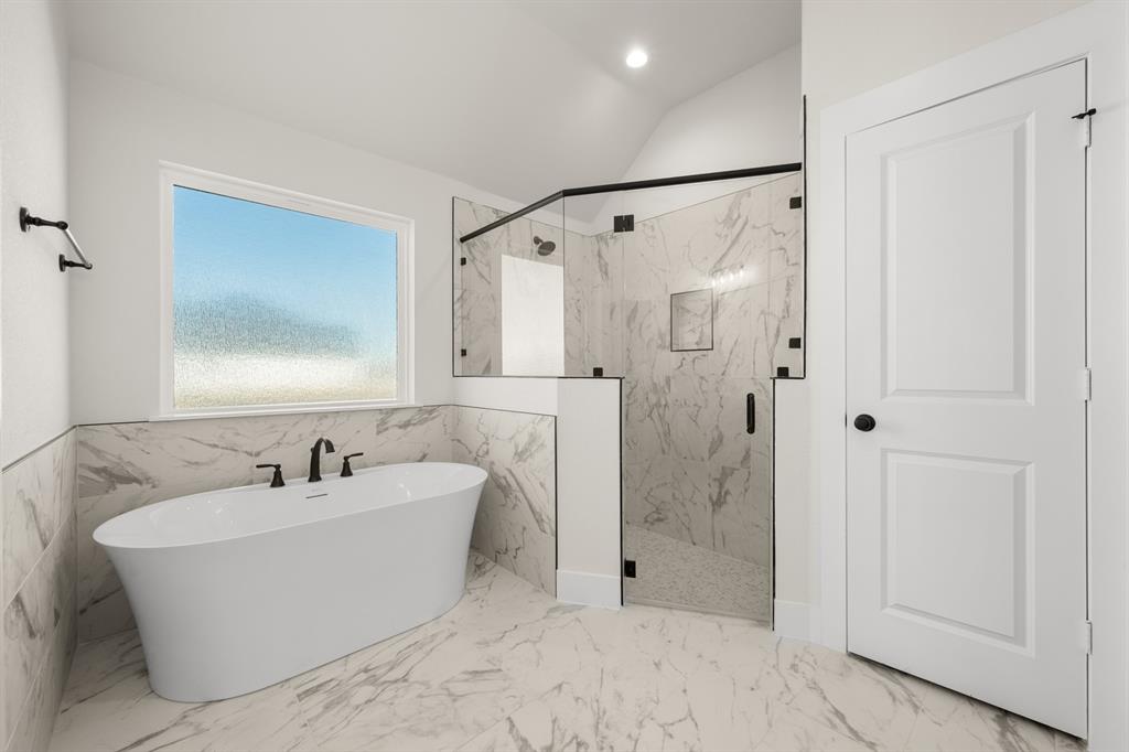 4867 Prairie Sky Lane DISH, TX 76247 - Photo 24 of 27 a bathroom with a bathtub and shower