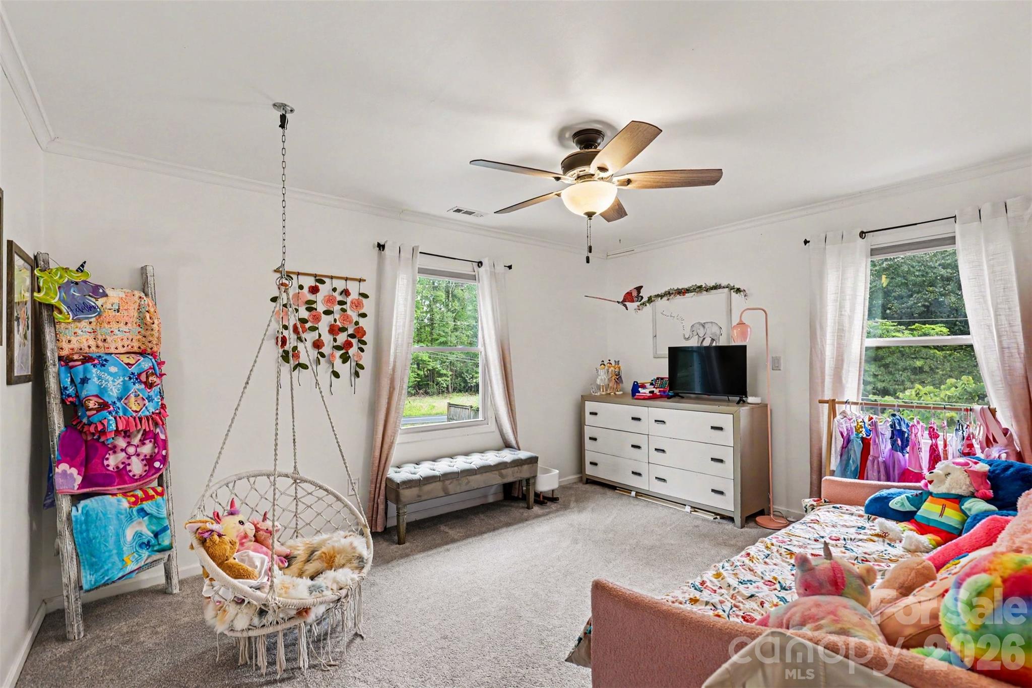 184 Canal Road Belmont, NC 28012 - Photo 35 of 39 a bedroom with furniture a bed and a chandelier