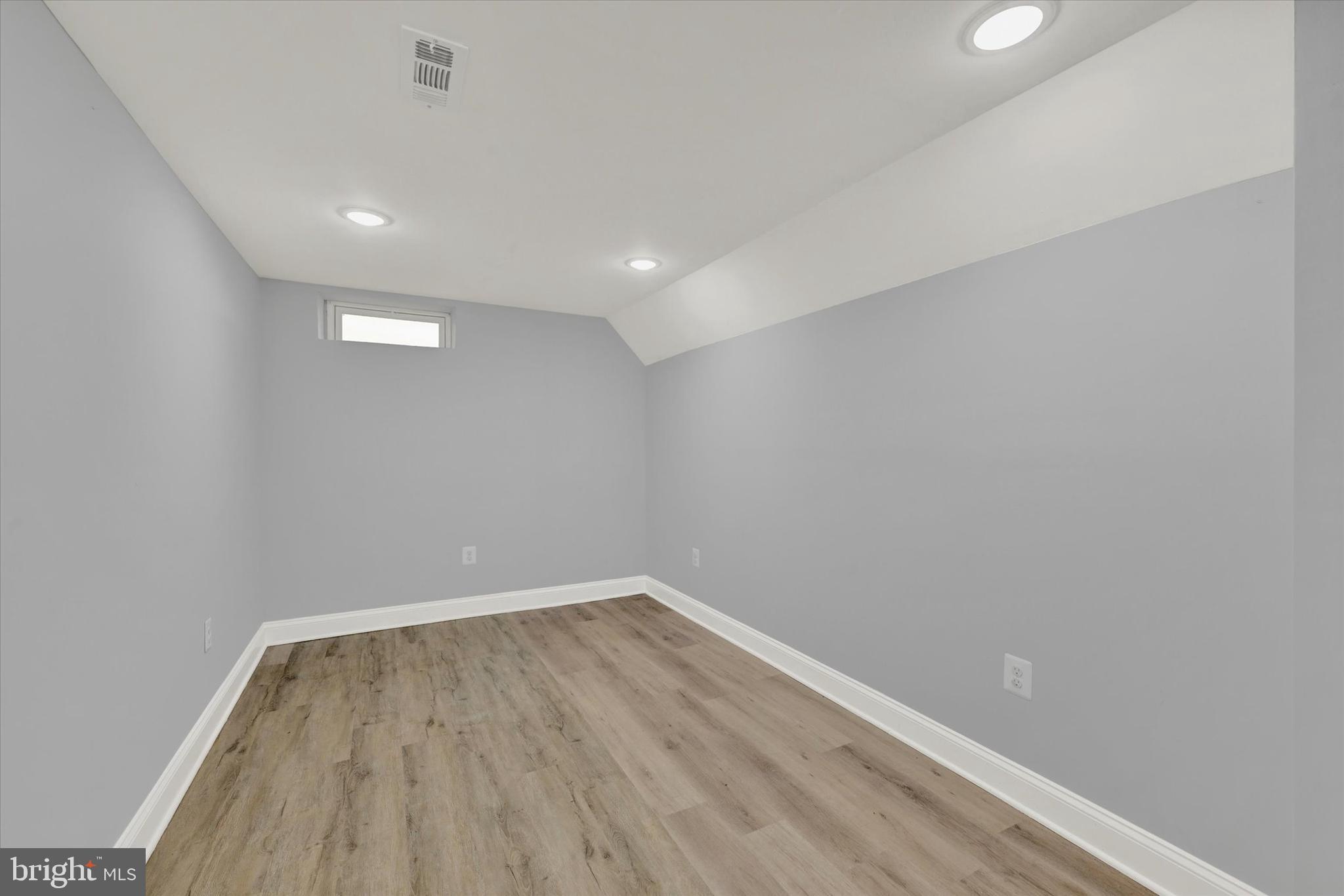 3105 Frisby Street Baltimore, MD 21218 - Photo 19 of 22 a view of room with wooden floor