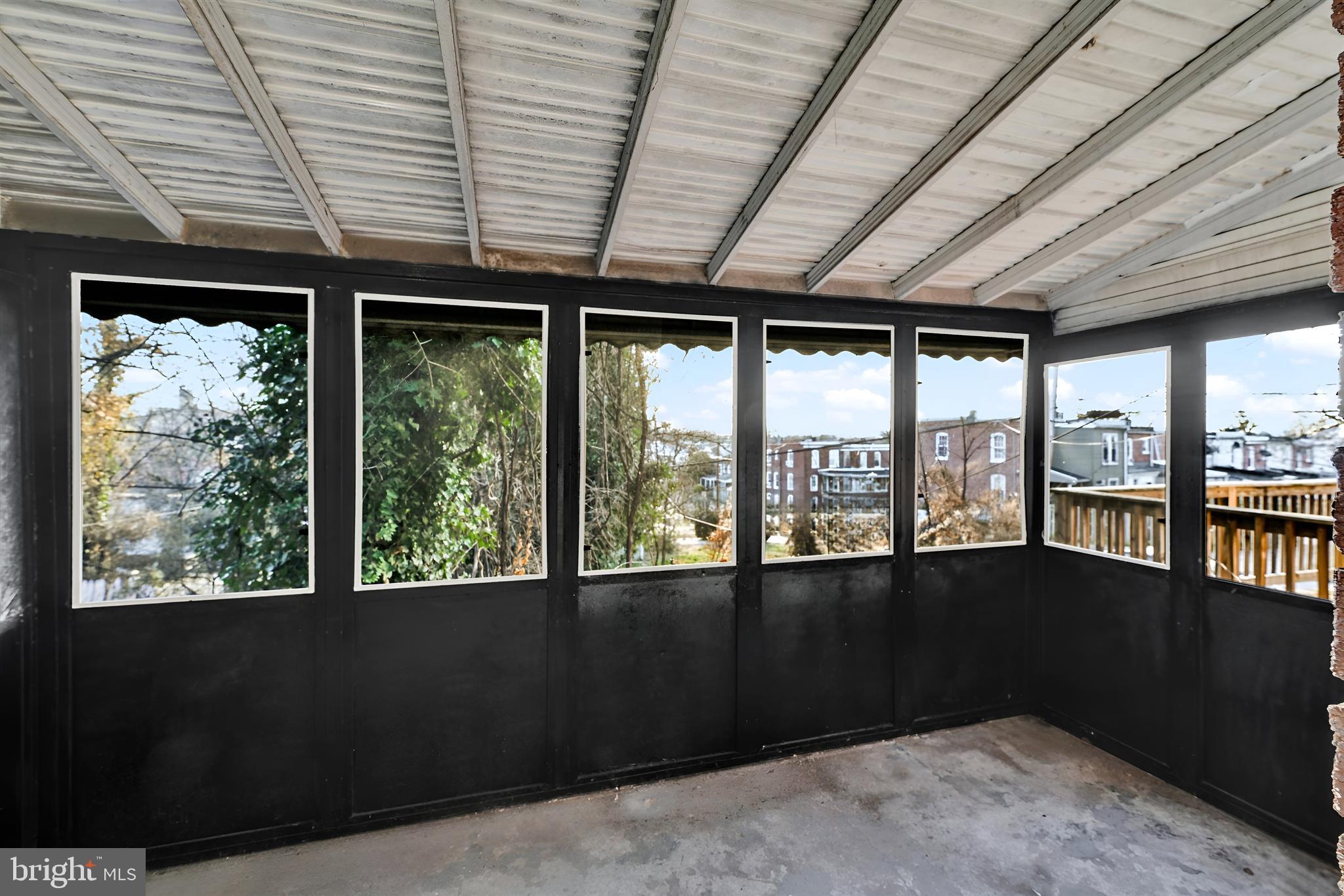 3105 Frisby Street Baltimore, MD 21218 - Photo 20 of 22 a front view of a building with large windows