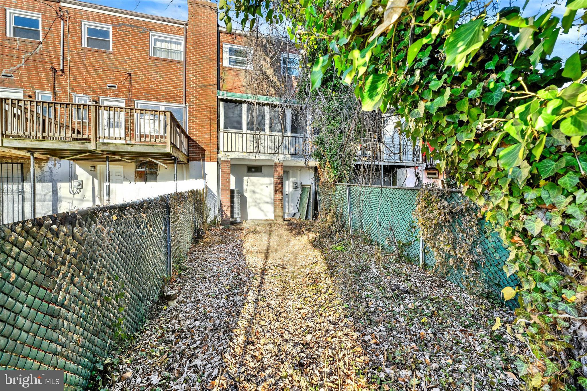 3105 Frisby Street Baltimore, MD 21218 - Photo 21 of 22 front view of a house with a garden