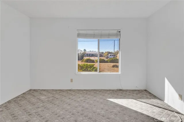 a view of an empty room and window