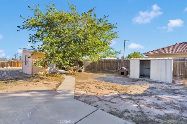 a view of a backyard of the house