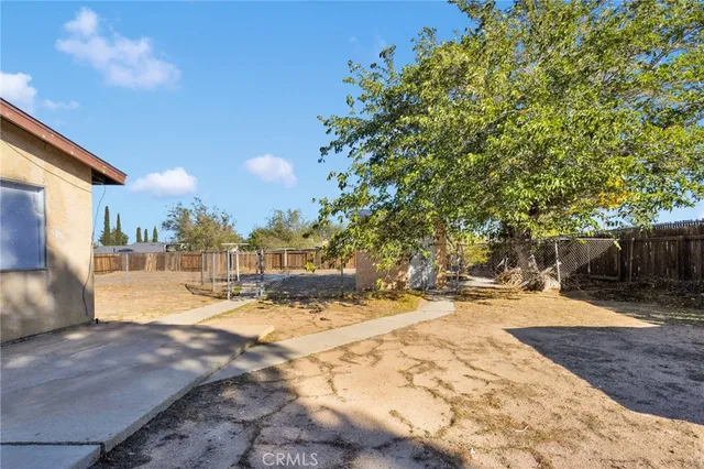 a view of a house with snow on the road