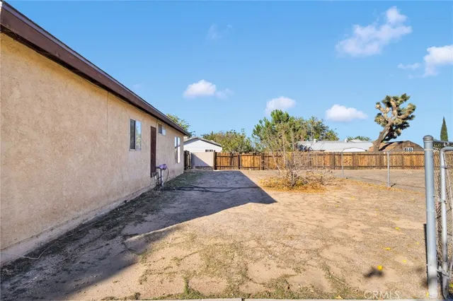 a vase of flowers sitting on a floor