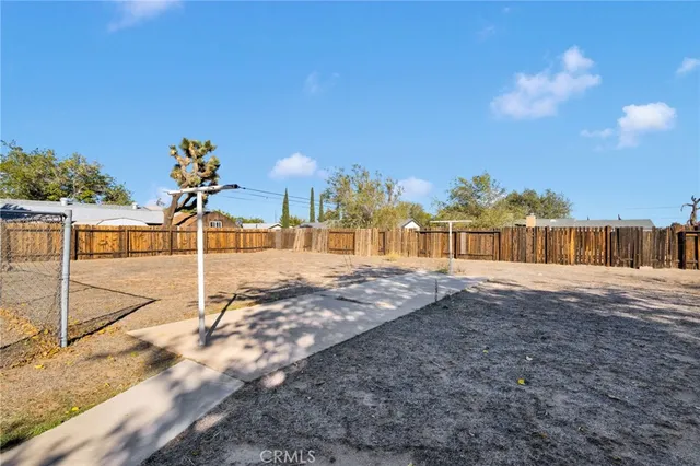 a view of a house with a yard and garage