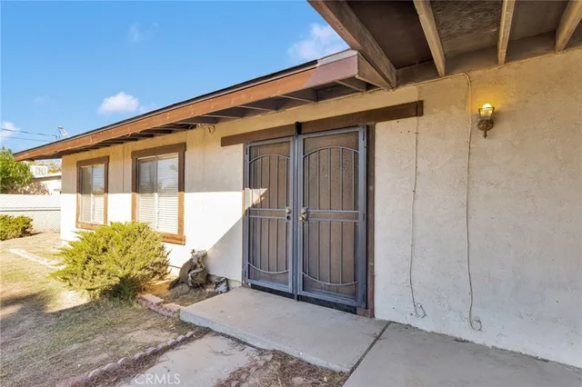 a front view of a house with a outdoor space