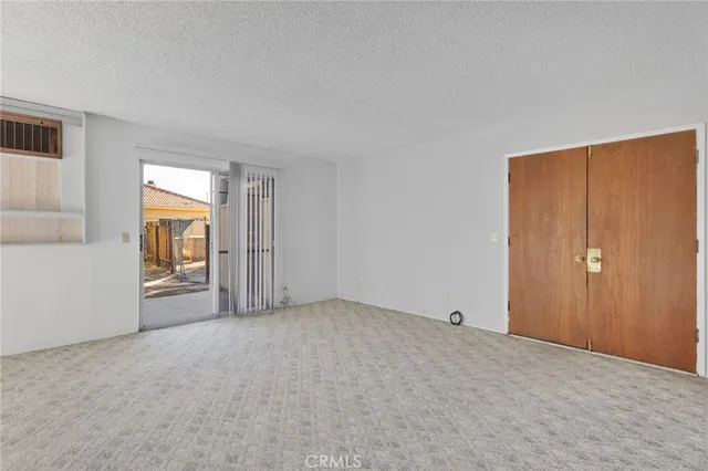 a view of an empty room and window