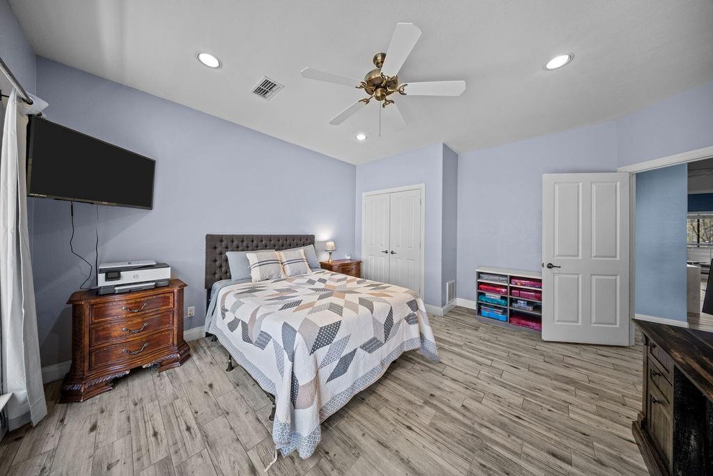 831 Union Hill Road Ennis, TX 75119 - Photo 23 of 38 a bedroom with a bed and a flat screen tv