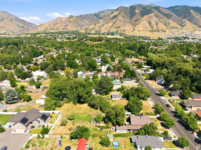 300 East S, Unit 2 Logan, UT 84321 - Photo 4 of 38 Expansive aerial perspective showcasing a residential area with a prominent mountain range backdrop